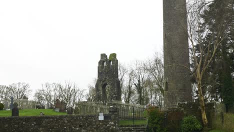 Preserved-9th-Century-Church-Round-Tower-In-Donaghmore-Cemetery,-Navan,-County-Meath,-Ireland