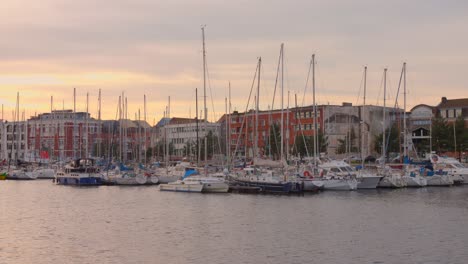 Anchored-Boats-At-Sunset-In-Dunkerque-Marina,-Dunkirk-In-The-Nord-Region-of-France