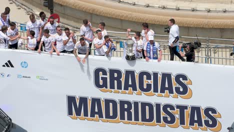 Real-Madrid-players-celebrate-their-36th-Spanish-football-league-championship,-the-La-Liga-title,-with-fans-at-Cibeles-Square,-where-thousands-gathered-in-Madrid,-Spain