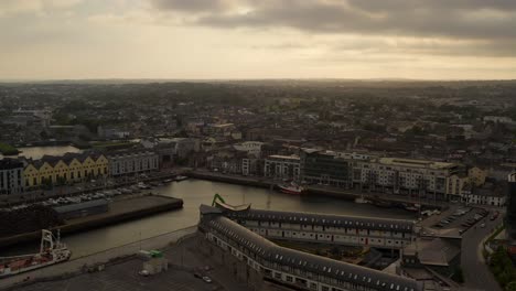 Aerial-Pan:-Galway-City-Golden-Hour,-Docks,-Colorful-Irish-Houses