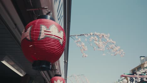 Red-Japanese-Paper-Lantern-Hanging-On-The-Building-In-Tokyo,-Japan