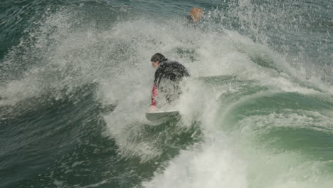 A-surfer-at-Steamer-Lane-in-Santa-Cruz,-California-gets-a-nice-wave