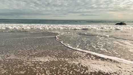 Beautiful-Pacific-Ocean-waves-rolling-into-shore-over-rocks