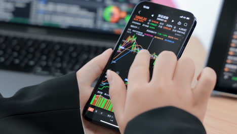 Crypto-trader-investor-broker-executing-financial-stock-trade-market-trading-order-to-buy-or-sell-cryptocurrency-by-using-cell-phone-smartphone-app