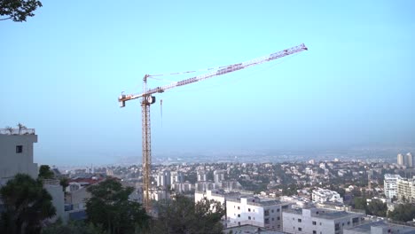 A-crane-works-in-Haifa,-Israel