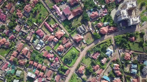 Drone-flyover-middle-class-residential-buildings-in-Bukasa-suburb,-Kampala-city,-Uganda