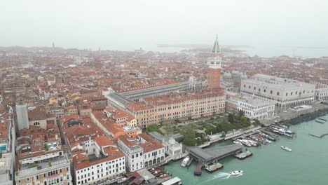 Venice-Italy-downtown-green-space-along-the-canal-aerial-on-foggy-day