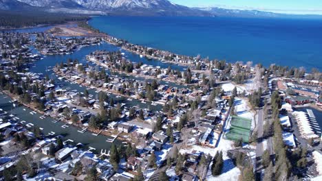 Aerial-View-of-Tahoe-Keys-Neighborhood-by-Lake-Tahoe,-California-USA-on-Sunny-Winter-Day,-Houses-and-Canals,-Drone-Shot