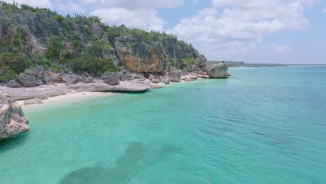 Transparent-and-shallow-waters-sea-along-rocky-coast-of-Jaragua-National-Park,-Pedernales-in-Dominican-Republic