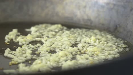 Chopped-garlic-frying-in-a-frying-pan