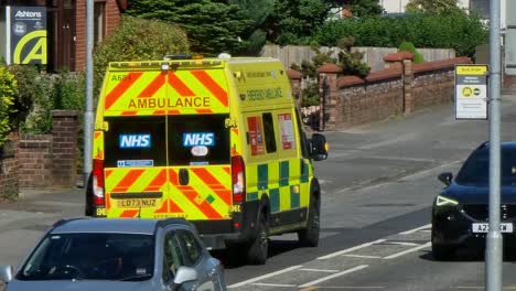 Paramedic-ambulance-attending-road-traffic-incident-in-British-neighbourhood