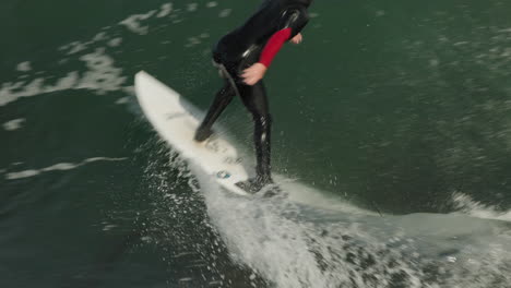 A-surfer-rides-a-nice-fast-wave-in-Santa-Cruz,-CA-at-Steamer-Lane