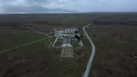 Drone-establishing-shot-of-abandoned-military-base-and-Voice-of-America-radio-station-headquarters-in-Greece