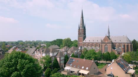 Crane-down-next-to-catholic-church-in-Budel-Cranendonck-Brabant-village