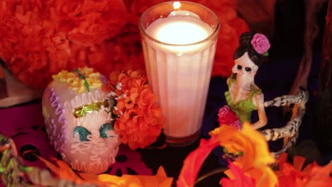 Día-De-Los-Muertos-Altar-With-Skeleton-Decorations-And-Burning-Candle