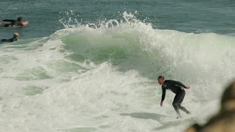 A-surfer-catches-a-nice-wave-at-Steamer-Lane-in-Santa-Cruz,-CA