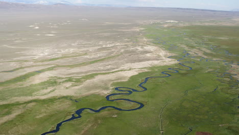 Aerial-drone-footage-view-of-Owens-river-Benton-crossing,-land,-grass-and-river