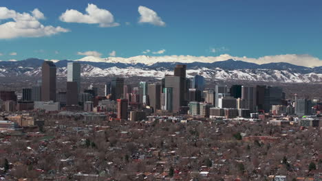 City-Wash-Park-Downtown-Denver-Colorado-aerial-drone-neighborhood-streets-Spring-Mount-Blue-Sky-Evans-Front-Range-Rocky-Mountains-foothills-skyscrapers-daytime-sunny-clouds-backward-motion