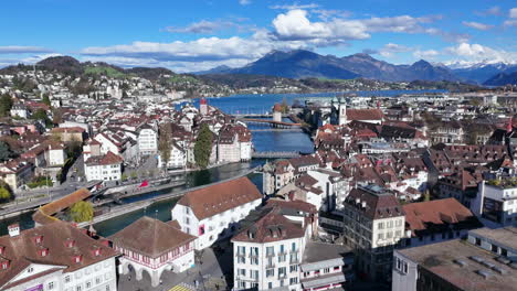 Luzern-cityscape-with-mountains-and-lake-on-a-sunny-day,-aerial-view