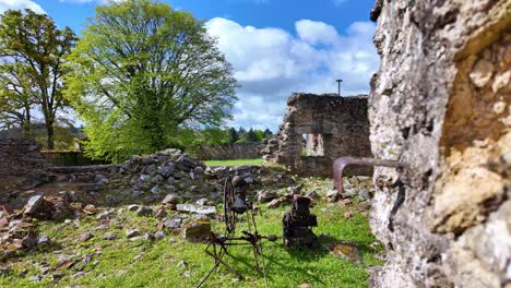 Ancient-objects-among-ruins-of-Oradour-sur-Glane-ghost-village,-Haute-Vienne-department,-New-Aquitaine-in-France