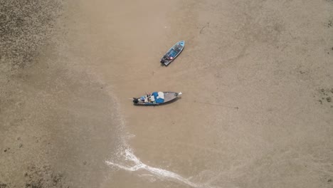 Aerial-Birds-Eye-View-Of-Fishing-Boats-On-Sandy-Ao-Tan-Beach-In-Koh-Mak