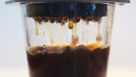 Coffee-flowing-through-filter-in-slow-motion