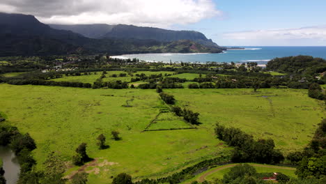 Aerial-Pan-Toward-Hanalei-Bay-from-Nearby-Hillside-on-Mostly-Clear-Day