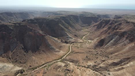 Drone-aerial-moving-back-over-the-Charles-knife-gorge-desolate-landscape