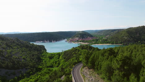 Flyover-Mountain-Road-Overlooking-Skradin-Town-Entrance-To-Krka-National-Park-In-Croatia