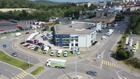 Stunning-aerial-of-a-Peugeot-car-repair-shop-on-a-busy-industrial-site