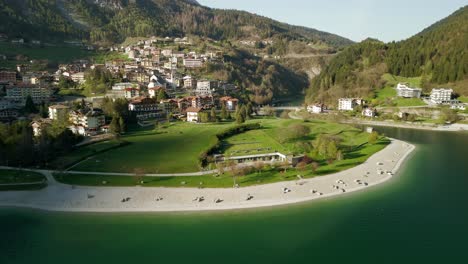 Aerial-View-Of-Beach-On-Lake-Molveno-in-Trentino,-Italy