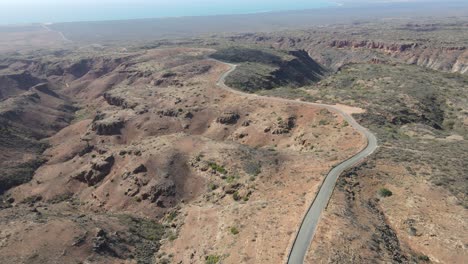 drone-aerial-moving-down-and-pan-right-over-a-road-on-Charles-knife-canyon
