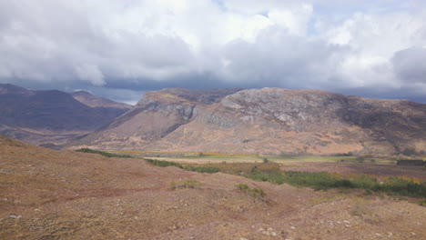 Scenic-view-of-Beinn-Eighe-mountains-in-Scotland-under-a-cloudy-sky