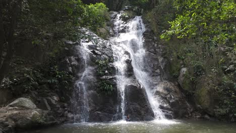 Waterfall-ends-in-large-tropical-pool-deep-in-forest-jungle-of-Minca-Colombia