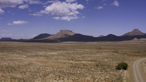 Aerial-Karoo-desert-landscape,-slow-takeoff-4K