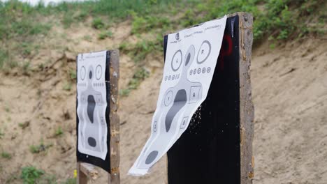 Paper-targets-with-human-silhouette-on-shooting-range-wooden-stand,-Czechia