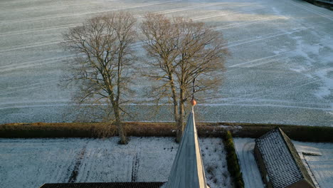 Aerial-of-church-at-sunset-in-winter