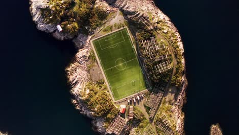 Top-down-close-up-aerial-360-of-the-Henningsvær-soccer-field,-Lofoten-Islands,-Norway