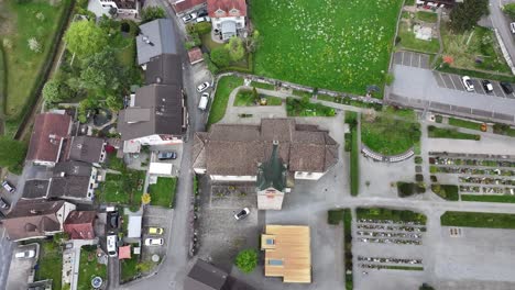 Drone-view-of-the-church-in-the-town-of-Walenstadt-with-the-adjacent-cemetery