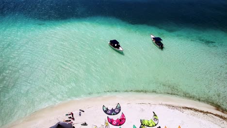 Two-boats-on-clear-turquoise-waters,-sunny-day,-los-roques,-venezuela,-aerial-view