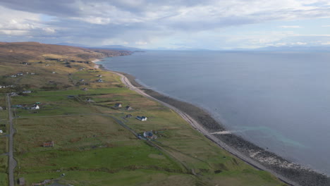 Melvaig-coastline-with-rolling-hills-and-scattered-houses,-scotland,-aerial-view