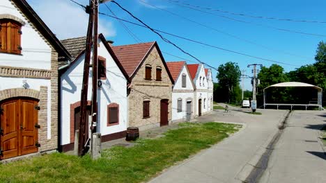 A-row-of-charming-historic-buildings-on-a-quiet-sunny-street-in-Hajos