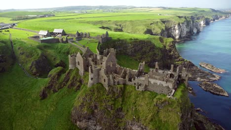 Aerial-shot-of-Dunluce-Castle,-in-Bushmills-on-the-North-County-Antrim-coast-in-Northern-Ireland