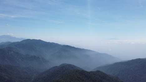 Panning-shot-hazy-neighboring-valleys-near-Mt-Baldy-in-southern-California