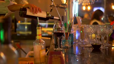 Bartender-pouring-wine-in-glass.-Static,-shallow-focus