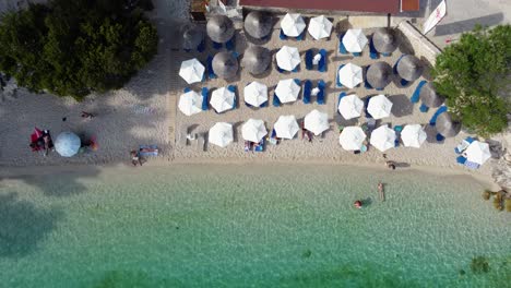 Top-View-over-Afteli-Beach-Shingle-Seashore,-Lefkada,-Evgiros,-Greece