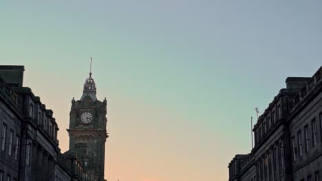 Edinburgh-city-centre-at-sunset,-tilt-down-on-Princes-St