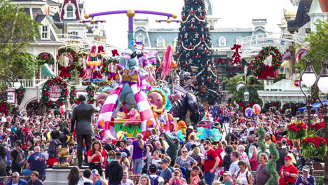 Time-lapse-of-a-Disney's-Magic-Kingdom-park-goers-experiencing-a-parade-down-Main-Street-USA-in-December-with-holiday-decorations