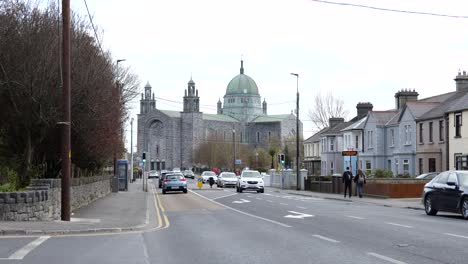 Galway-Cathedral-in-Distance,-Galway-City,-Ireland,-Traffic