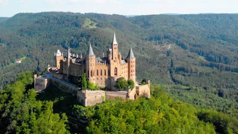 Aerial,-pull-back,-drone-shot,-away-from-the-Burg-Hohenzollern-castle,-sunny,-summer-day,-in-Baden-Wurttemberg,-Swabia,-Germany
